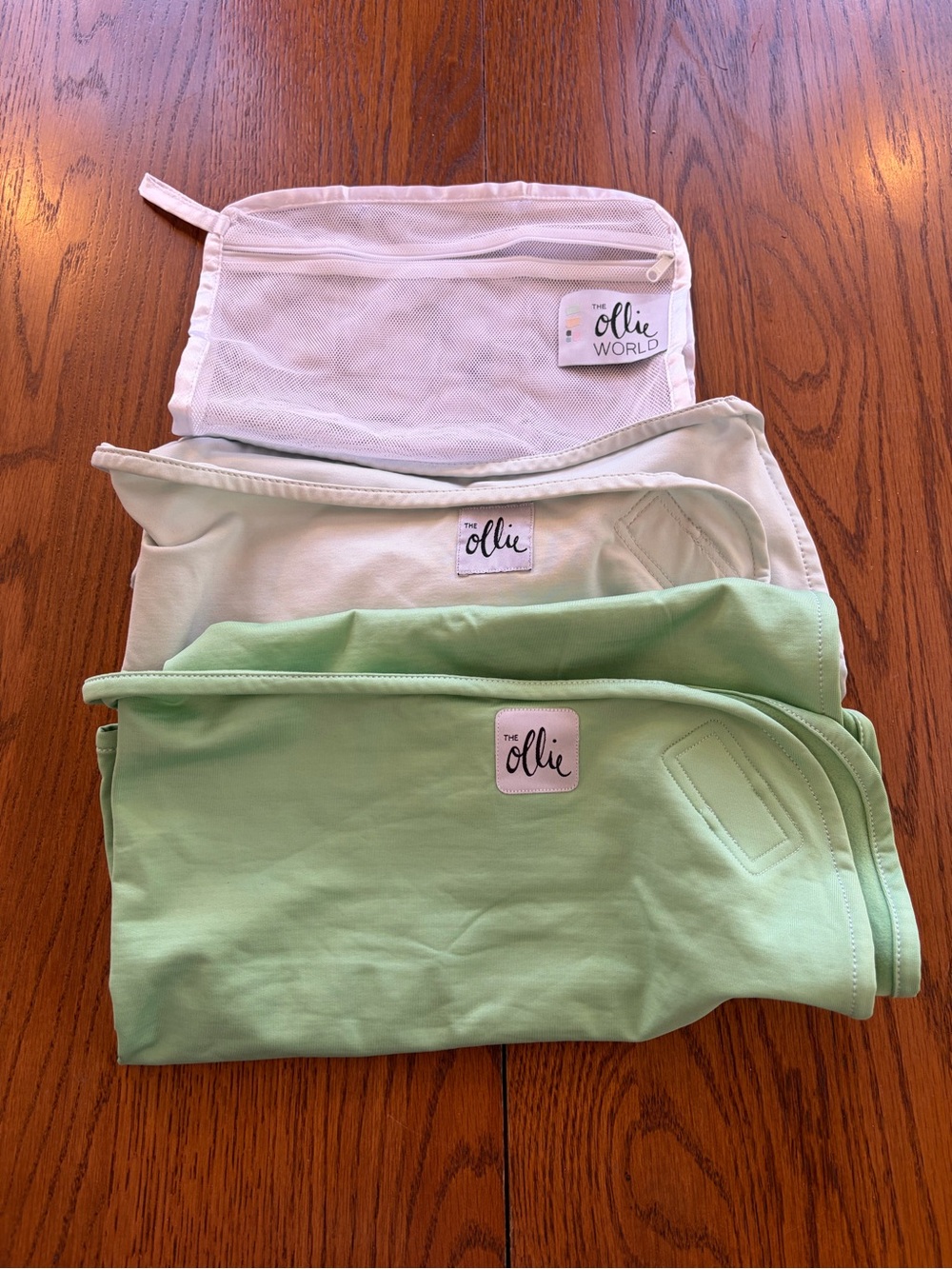 The Ollie swaddle light blue (great condition)+ Light Green (new no tags)